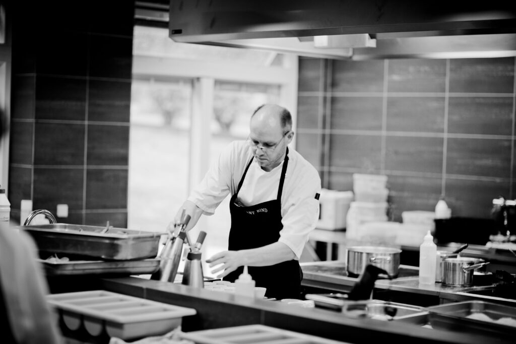 A person working in a restaurant kitchen.