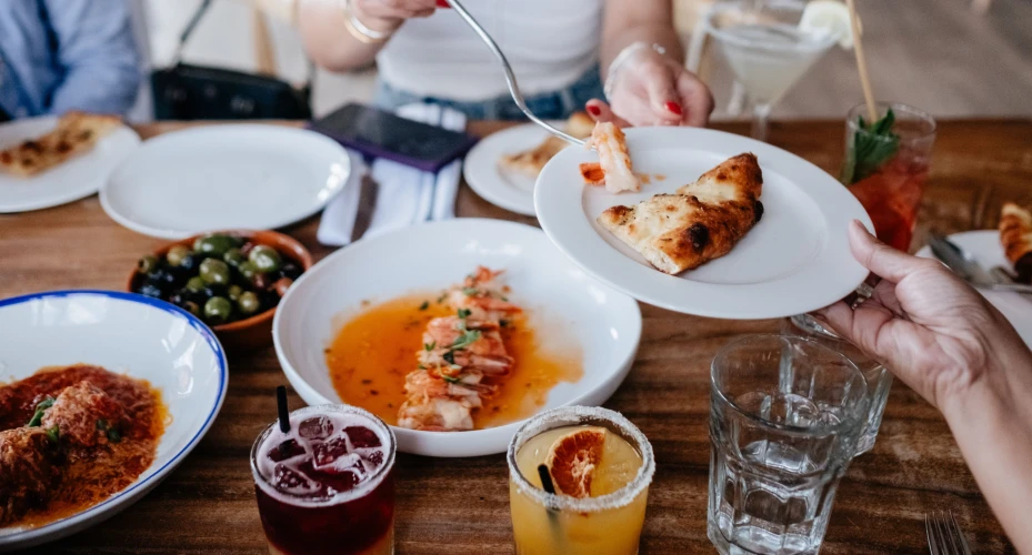 Different plates of food being shared